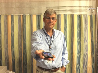 Dr. Bjug Borgundvaag holding ipod with tremor app
