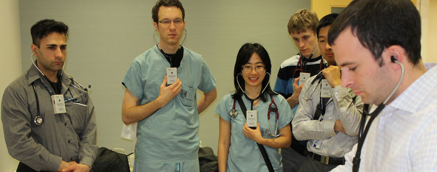 Medical students observe teacher